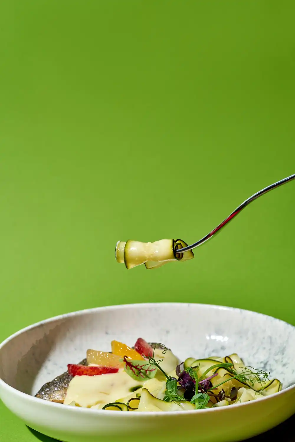 Razan holding a camera or styling food